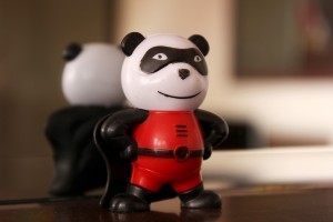toy panda dressed as a super hero